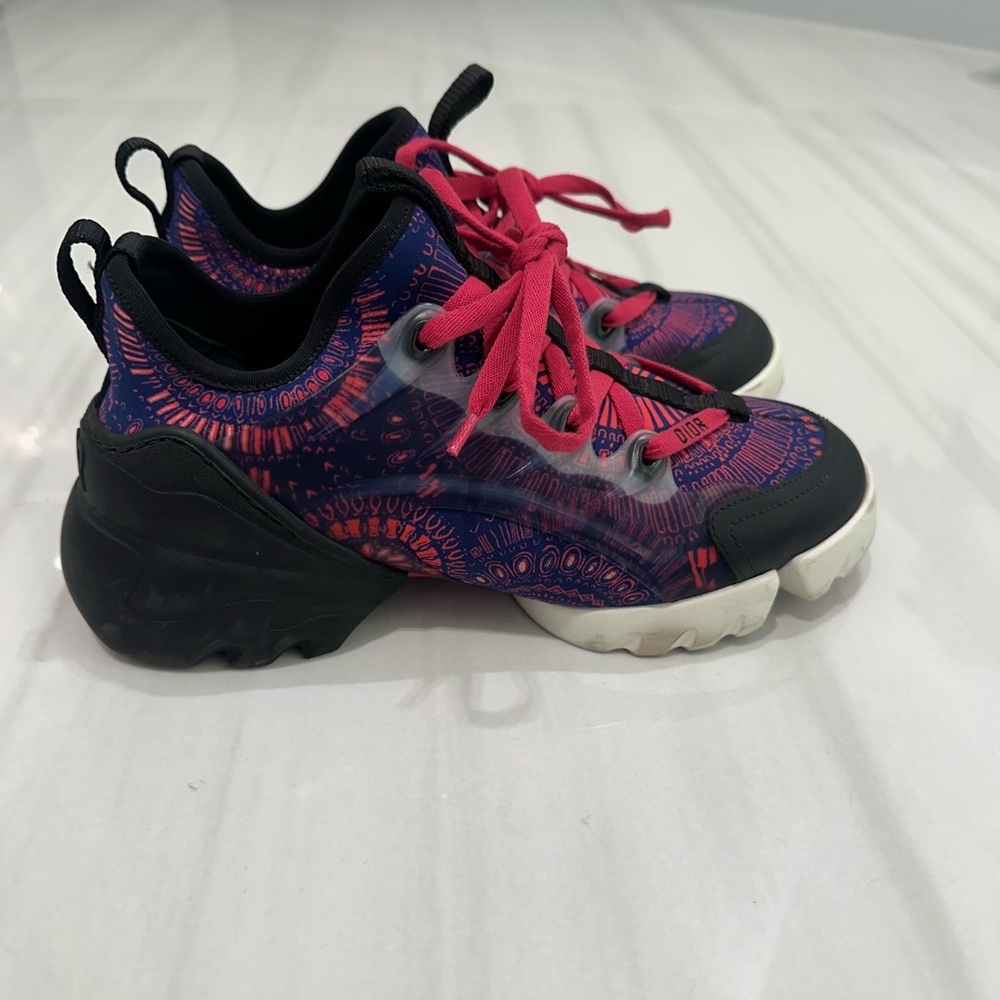 Dior sneakers with pink/black pattern.